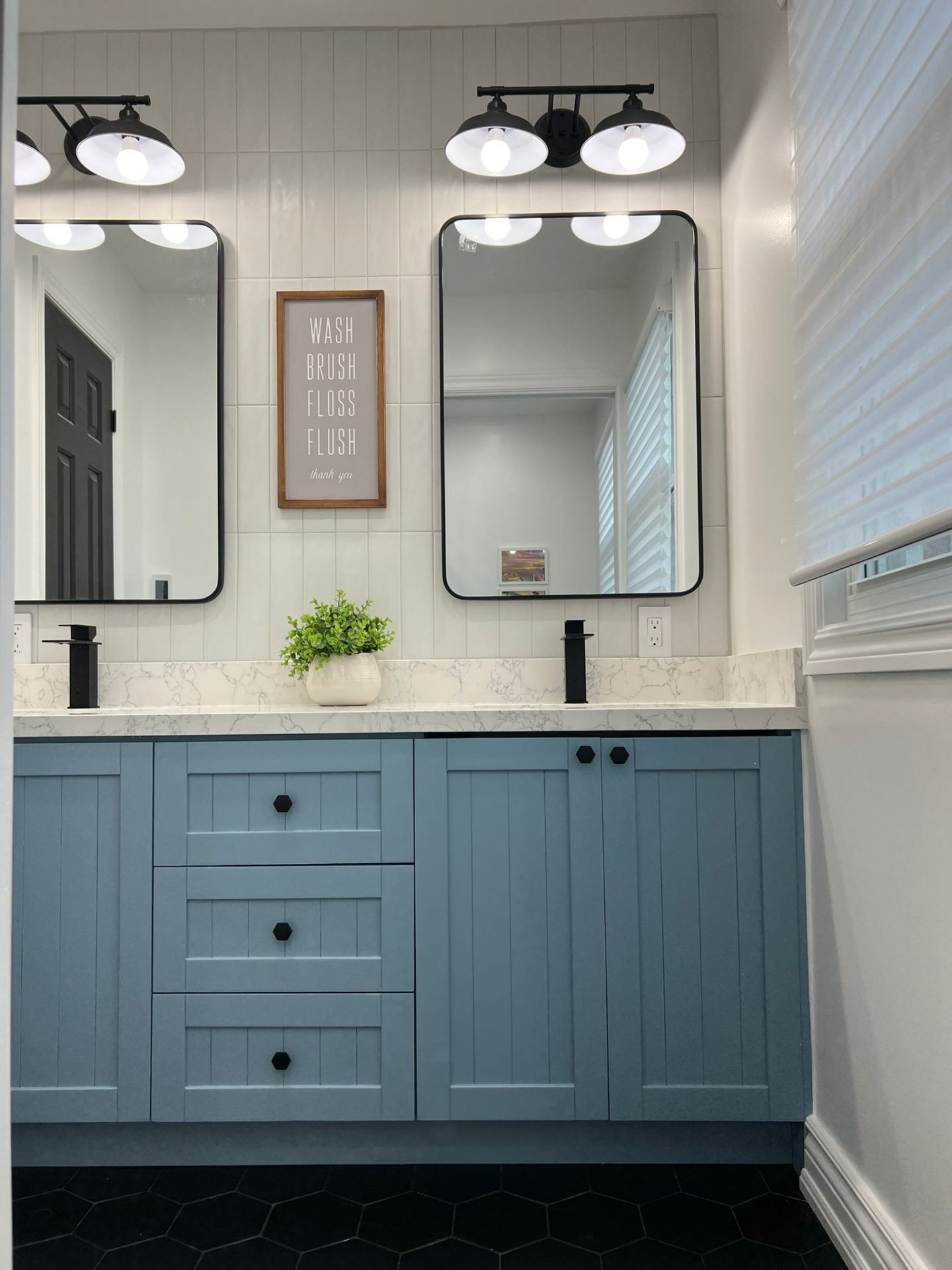 Modern blue bathroom vanity with double mirrors
