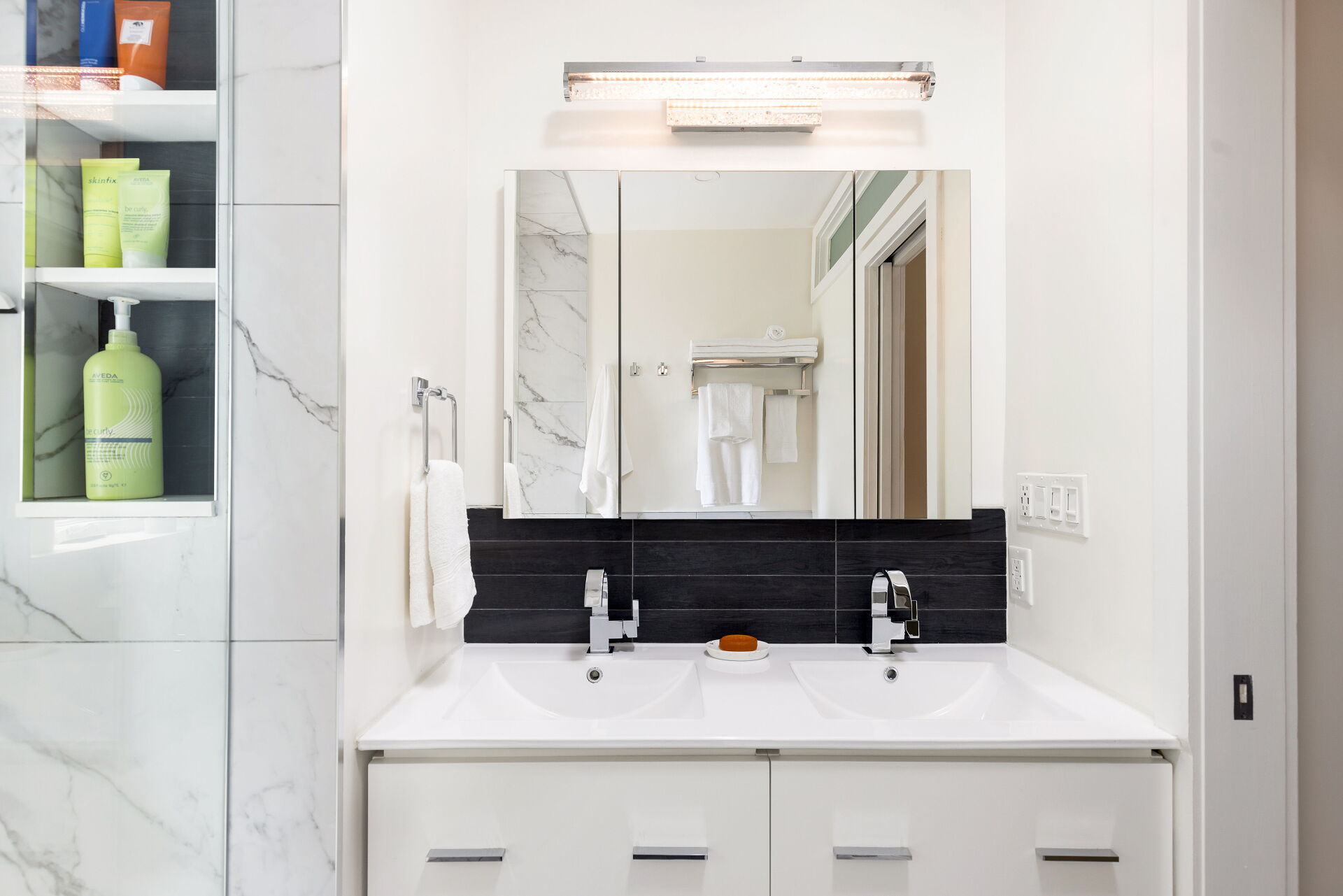 Modern bathroom vanity with double sinks and mirror
