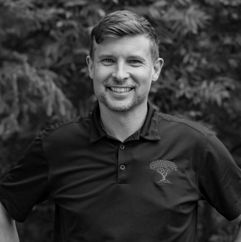 Smiling man in polo shirt outdoors