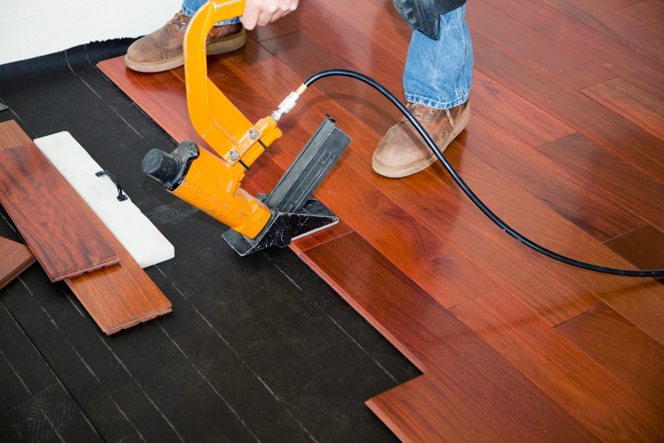 Installing hardwood flooring with pneumatic floor nailer