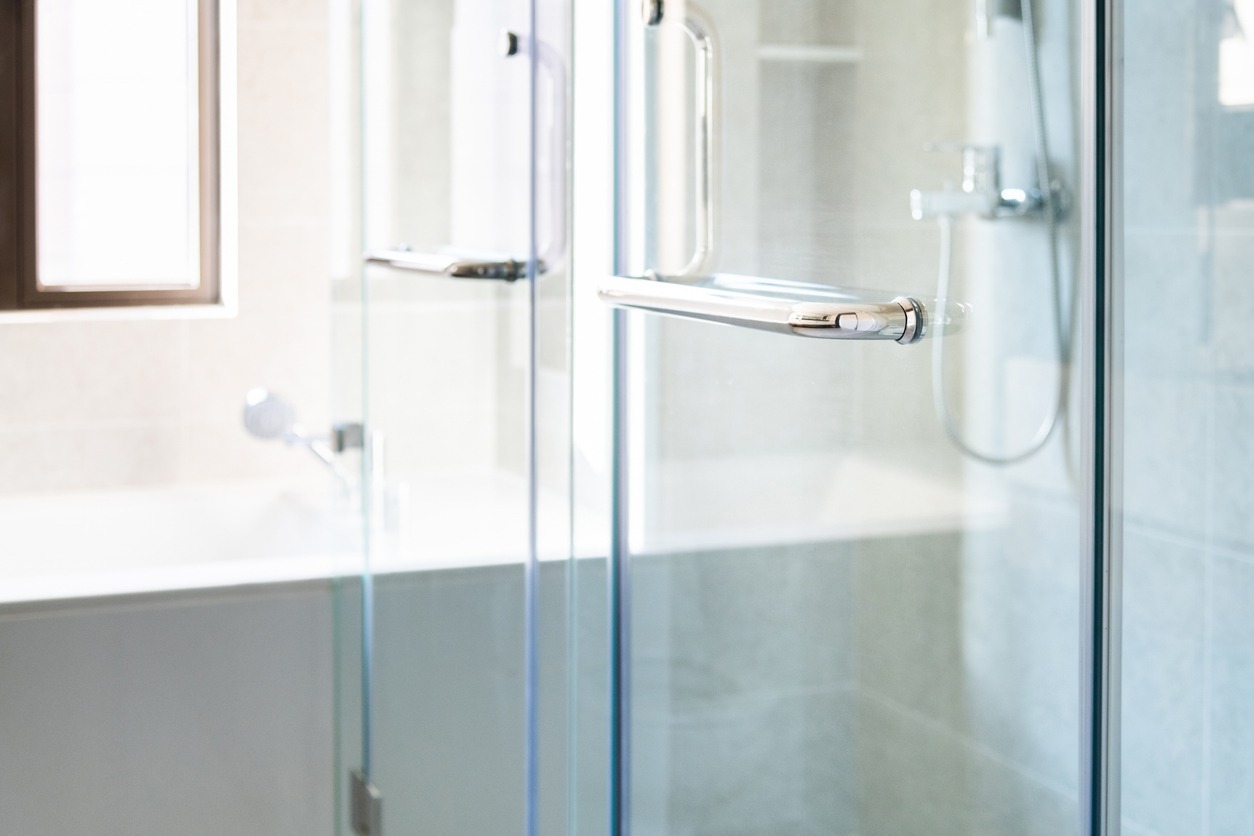 Modern glass shower enclosure with chrome handles